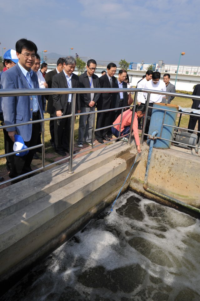 Photo 5 - The delegation witnessed the sampling of treated waste water before discharge into Dongjiang.