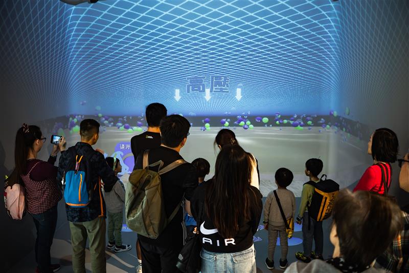 Members of the public were attracted to watch the  video on the giant screen in the exhibition hall.